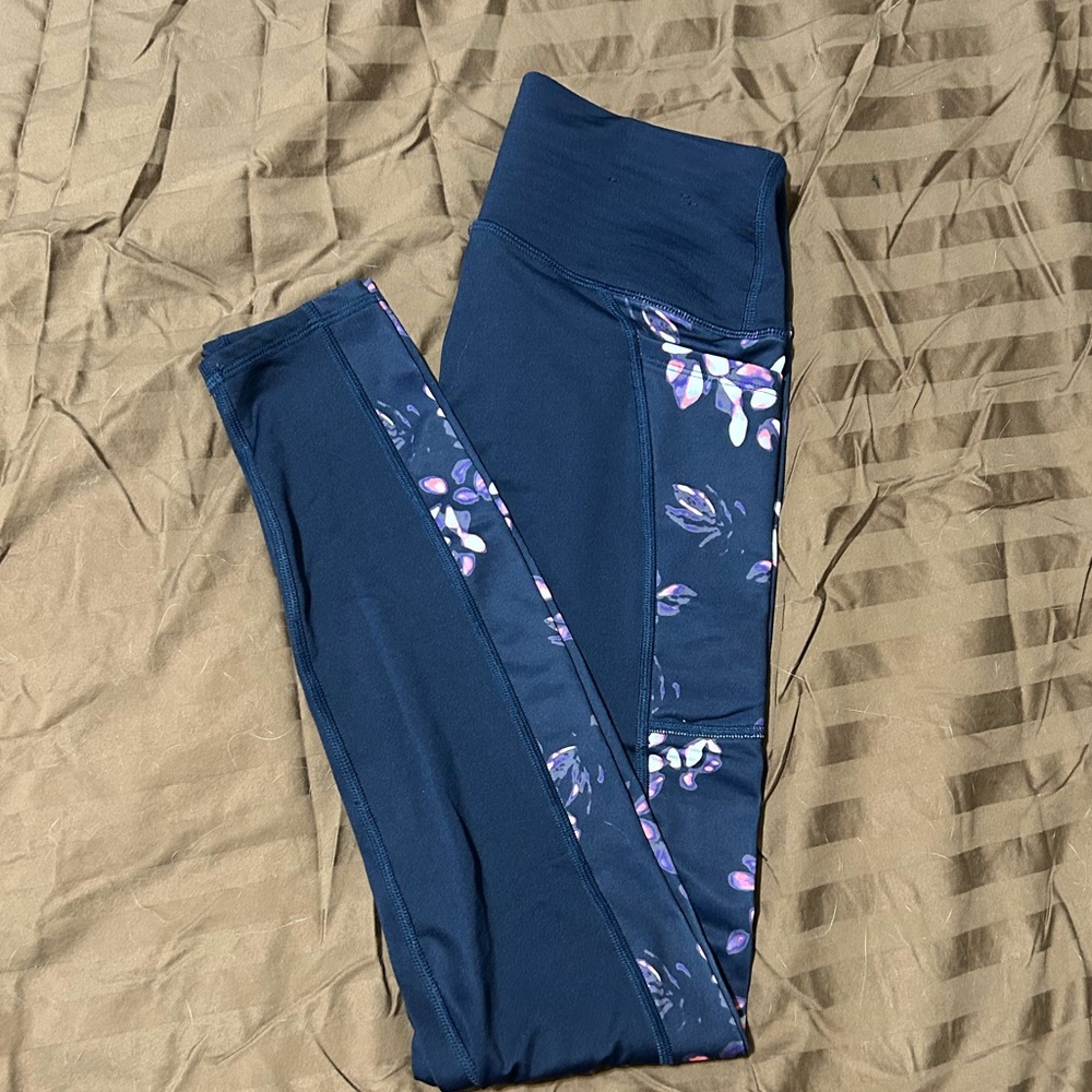 Under armor leggings. Navy blue with pink, purple, and white floral print.